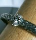 Photo18: Twelve Small Skull On 7.5mm Chiseled Wire O-ring Bangle