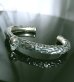 Photo15: Twelve Small Skull On 7.5mm Chiseled Wire O-ring Bangle