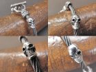 More Photo1: Quarter 5Skulls with stud bolo neck cable wire bracelet